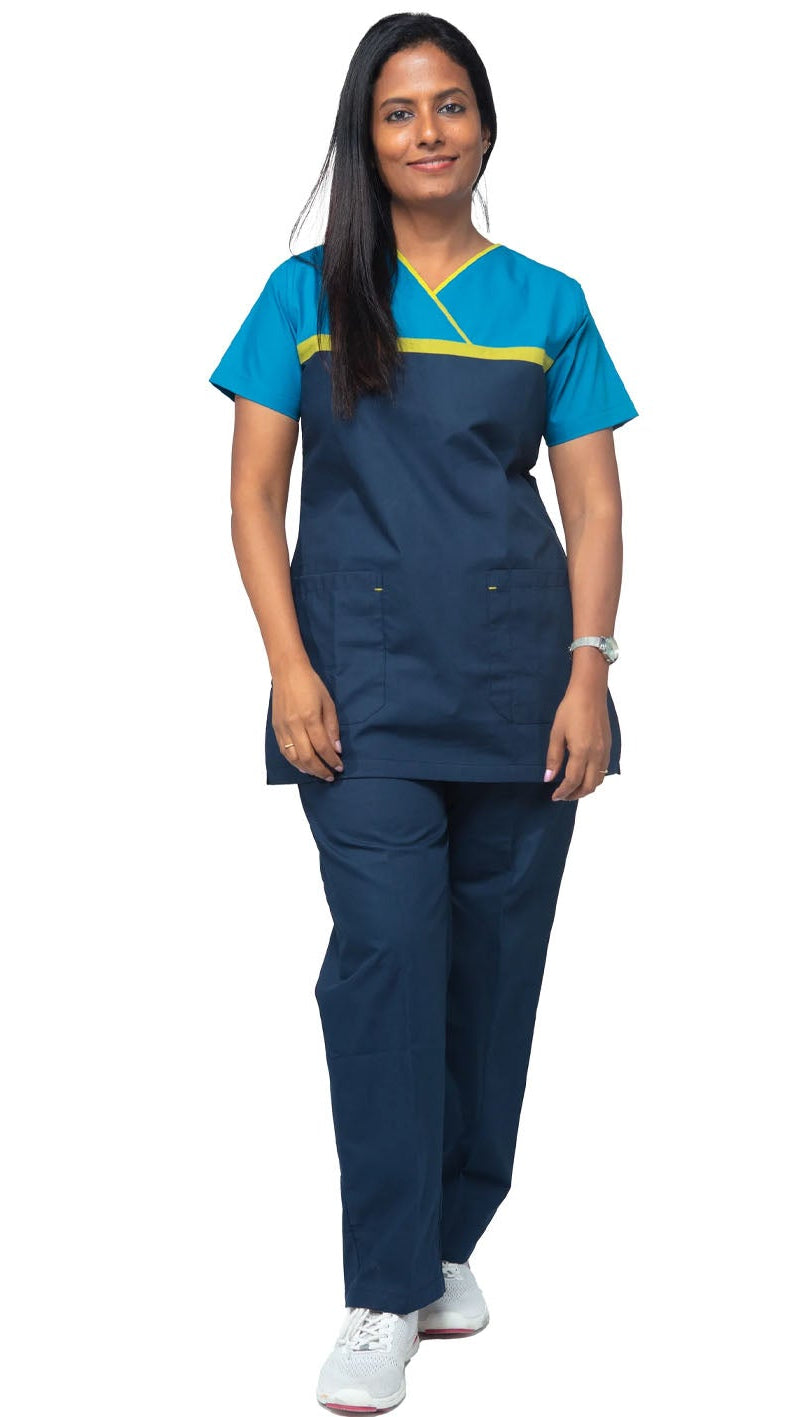 Person wearing a blue and navy medical scrub set on a white background