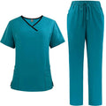 Teal scrub set with top and pants on a white background