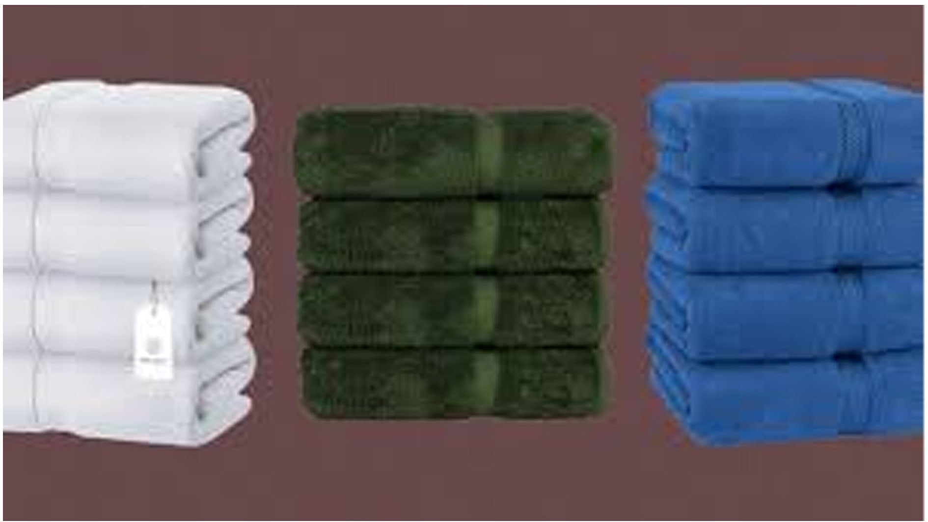 Stacks of white, green, and blue towels on a brown background