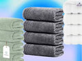 Stack of gray towels with a green towel and white tag on a blue gradient background