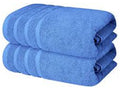 Set of blue towels stacked on a white background