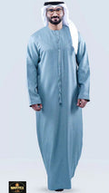 Man wearing a light blue traditional outfit on a white background