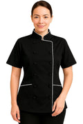 A woman modeling a black short-sleeve uniform jacket with white piping and black buttons, set against a plain white background.